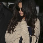 Selena Gomez arrives at Charles de Gaulle airport for the Fashion Week.