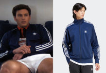 Monstres : L’histoire de Lyle et Erik Menendez : la veste de survête bleu marine d’Erik dans l’épisode 6